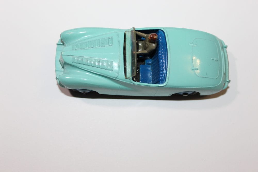 Vintage Dinky Toys Sunbeam Alpine Tourer diecast model car, blue with detailed interior.
