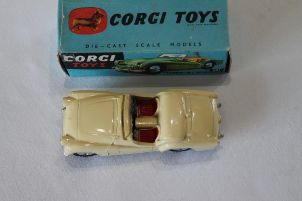 A Corgi Toys 301 Triumph TR2 Sports Car, cream body, red seats, flat