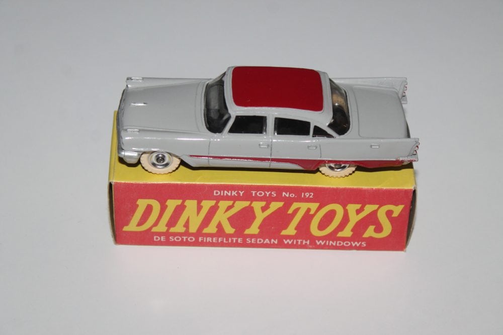 Dinky Toys 192 De Soto Fireflite model car with red roof and silver body.