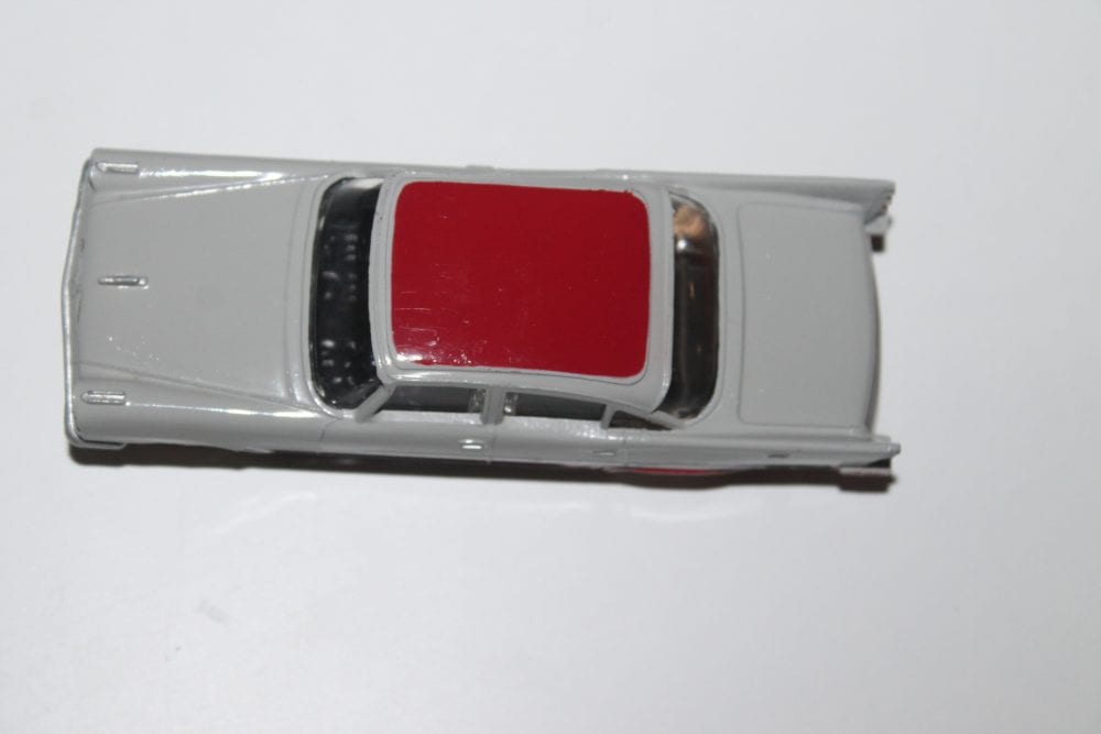 Vintage Dinky Toys 192 De Soto Fireflite diecast model car, white with red roof.