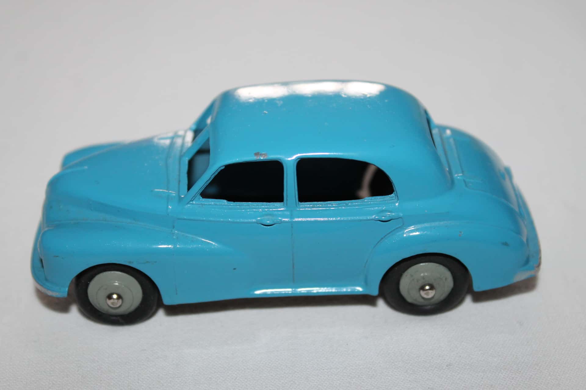 A Dinky Toys No. 159 Morris Oxford saloon, finished in green and cream