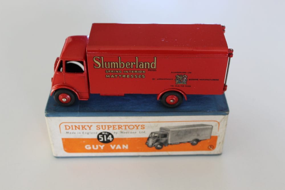 Dinky Toys 514 Guy Slumberland Van diecast model on original box, vintage toy vehicle.