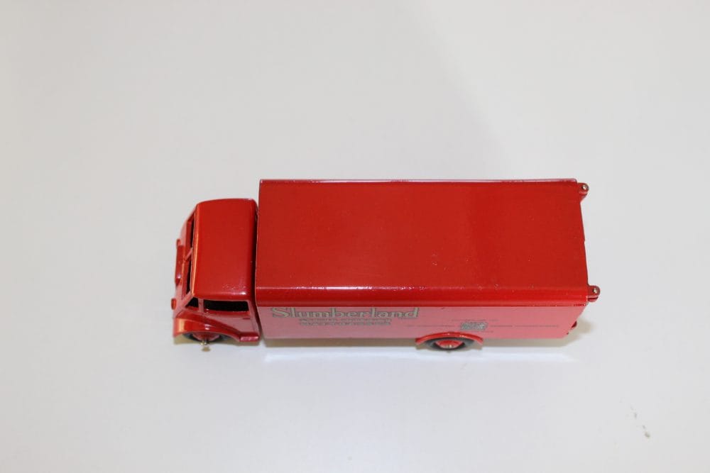 Dinky Toys 514 Guy Slumberland Van toy model, red diecast vehicle for collectors.
