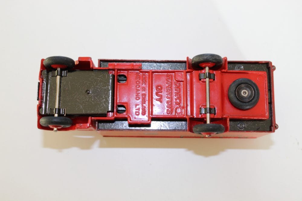 Dinky Toys 514 Guy Slumberland Van diecast model, underside view, vintage toy vehicle.