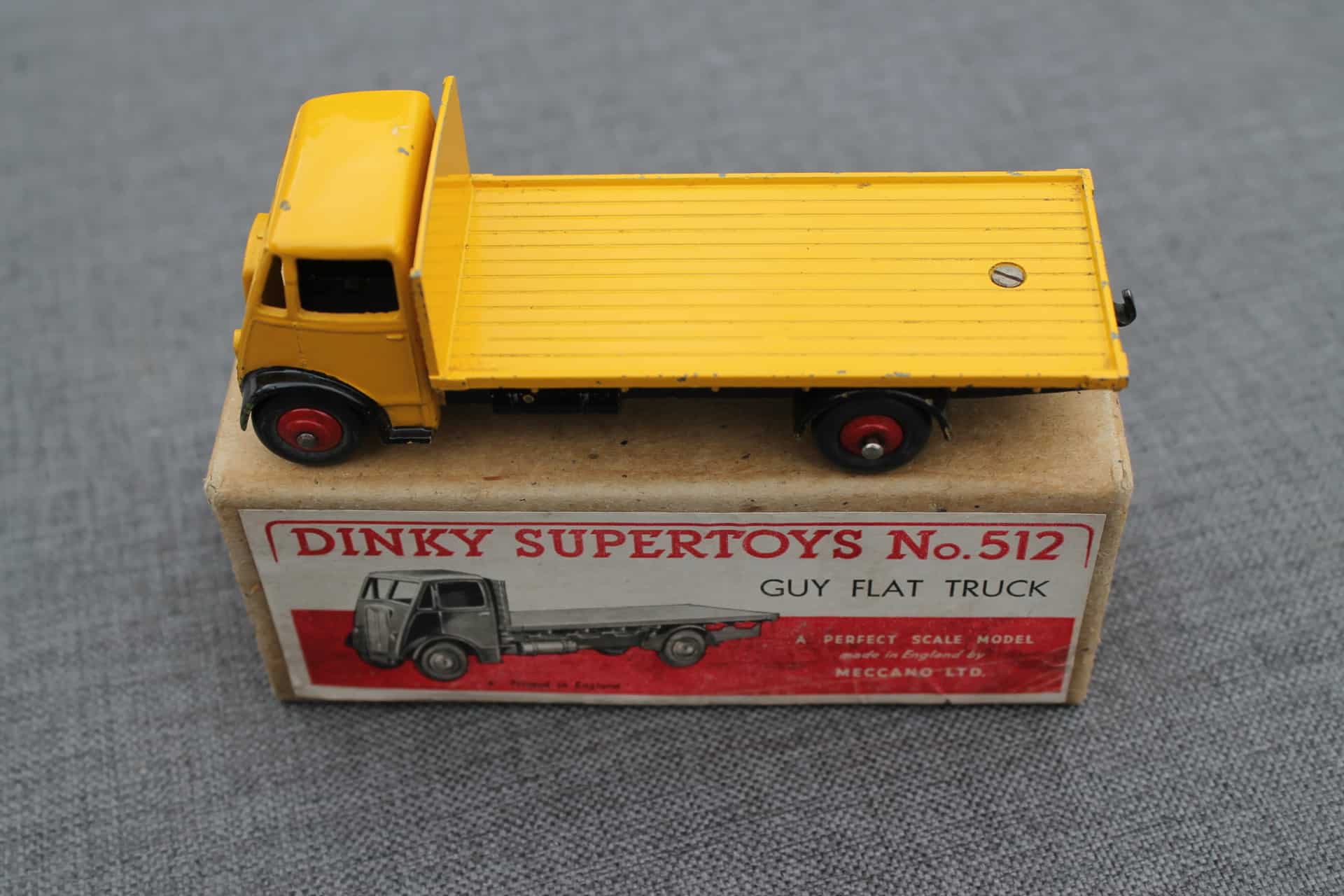 A boxed Dinky Toys No.512 dark blue and red Guy Flat Truck, Nr M-M, box Ex