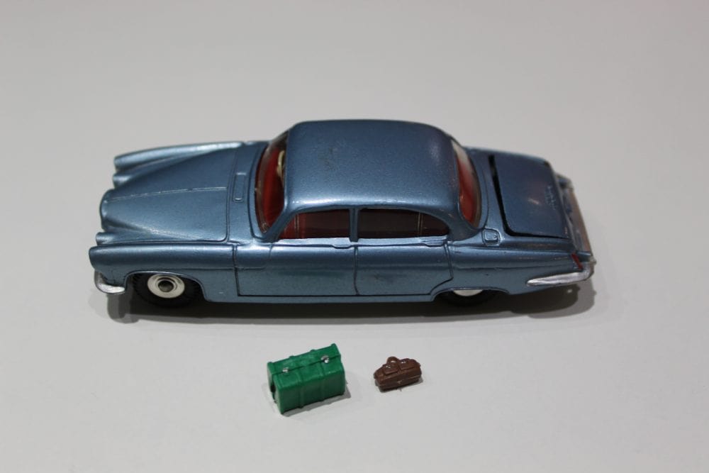 Dinky Toys 142 Jaguar Mark X diecast model with accessories, vintage collectible car.