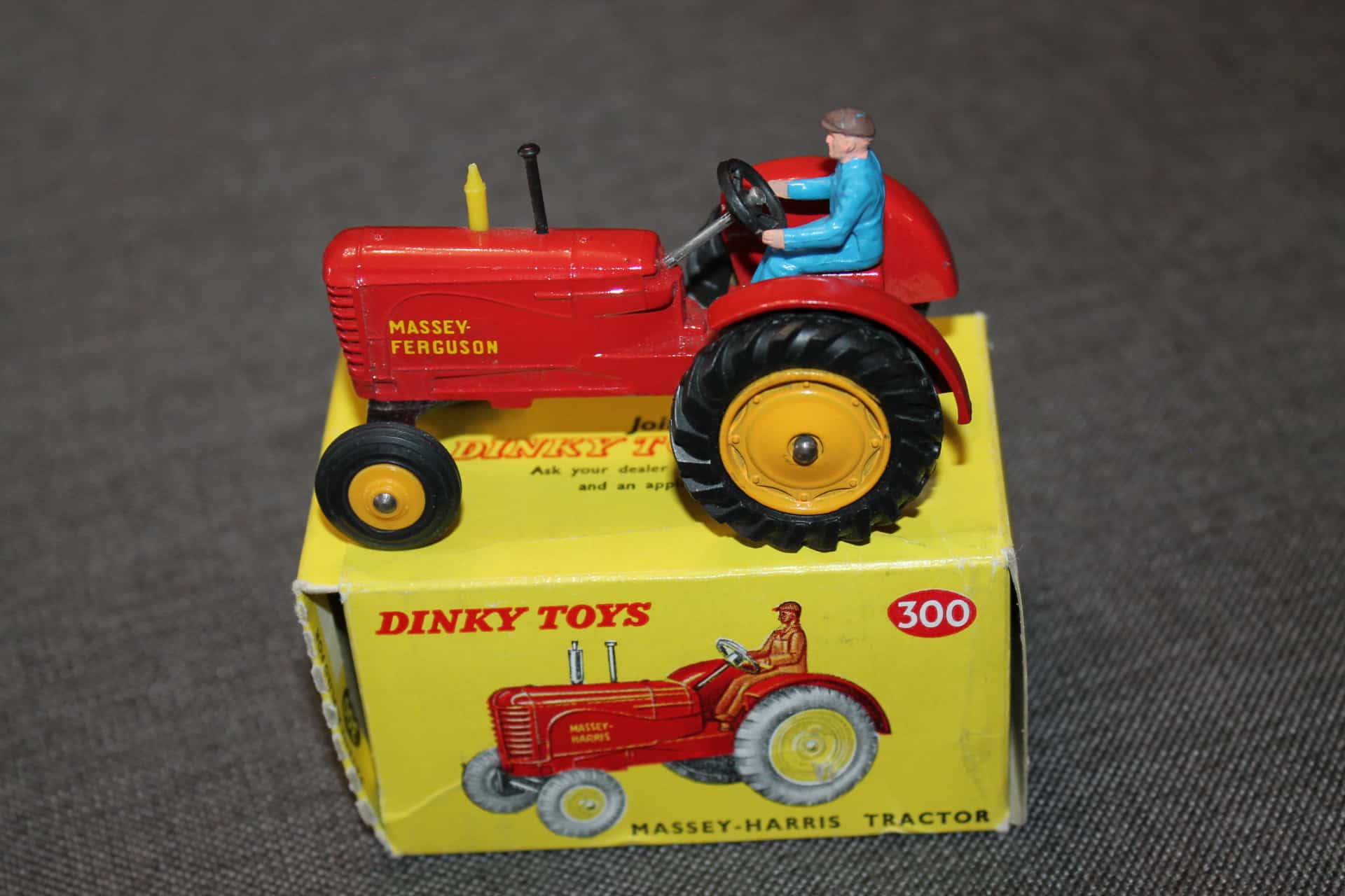 A boxed Dinky Toys No.300 Massey-Harris Tractor, M, box Ex pus with packing