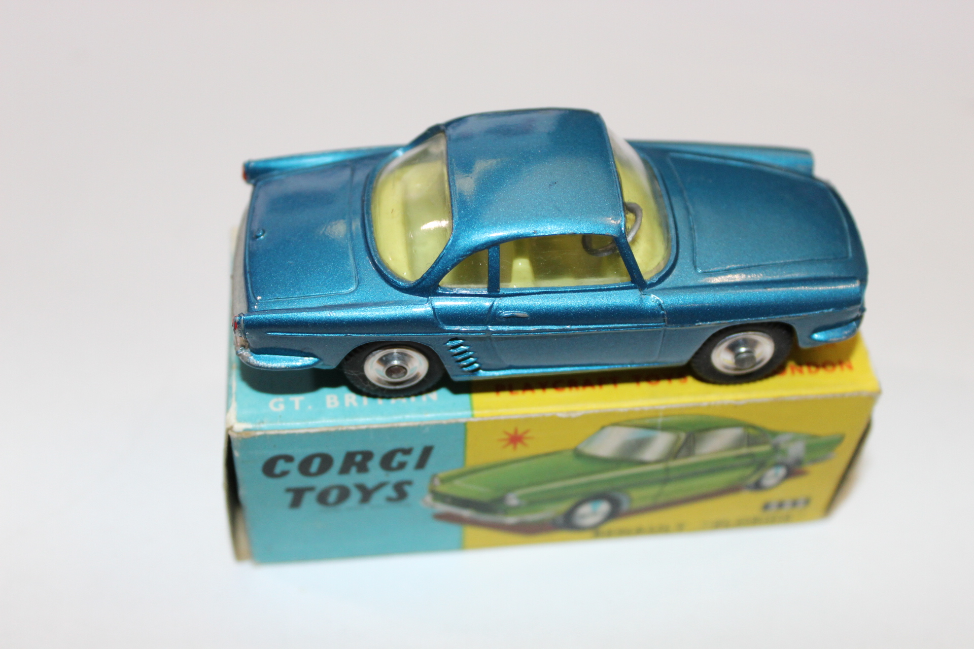 Vintage blue diecast car toy on Corgi Toys box, collectible diecast model.