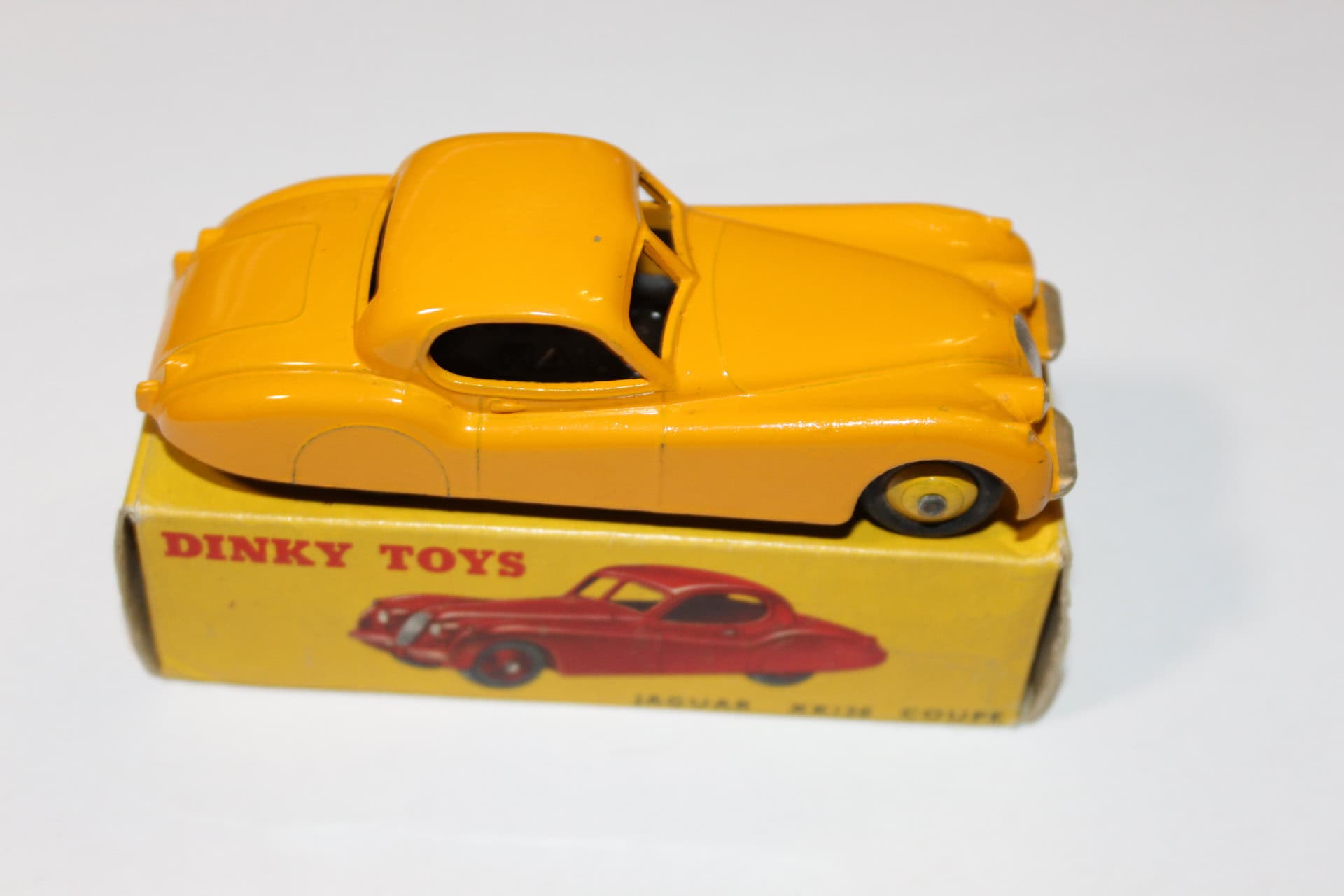 Vintage Dinky Toys 30C Daimler model car in yellow with original box.