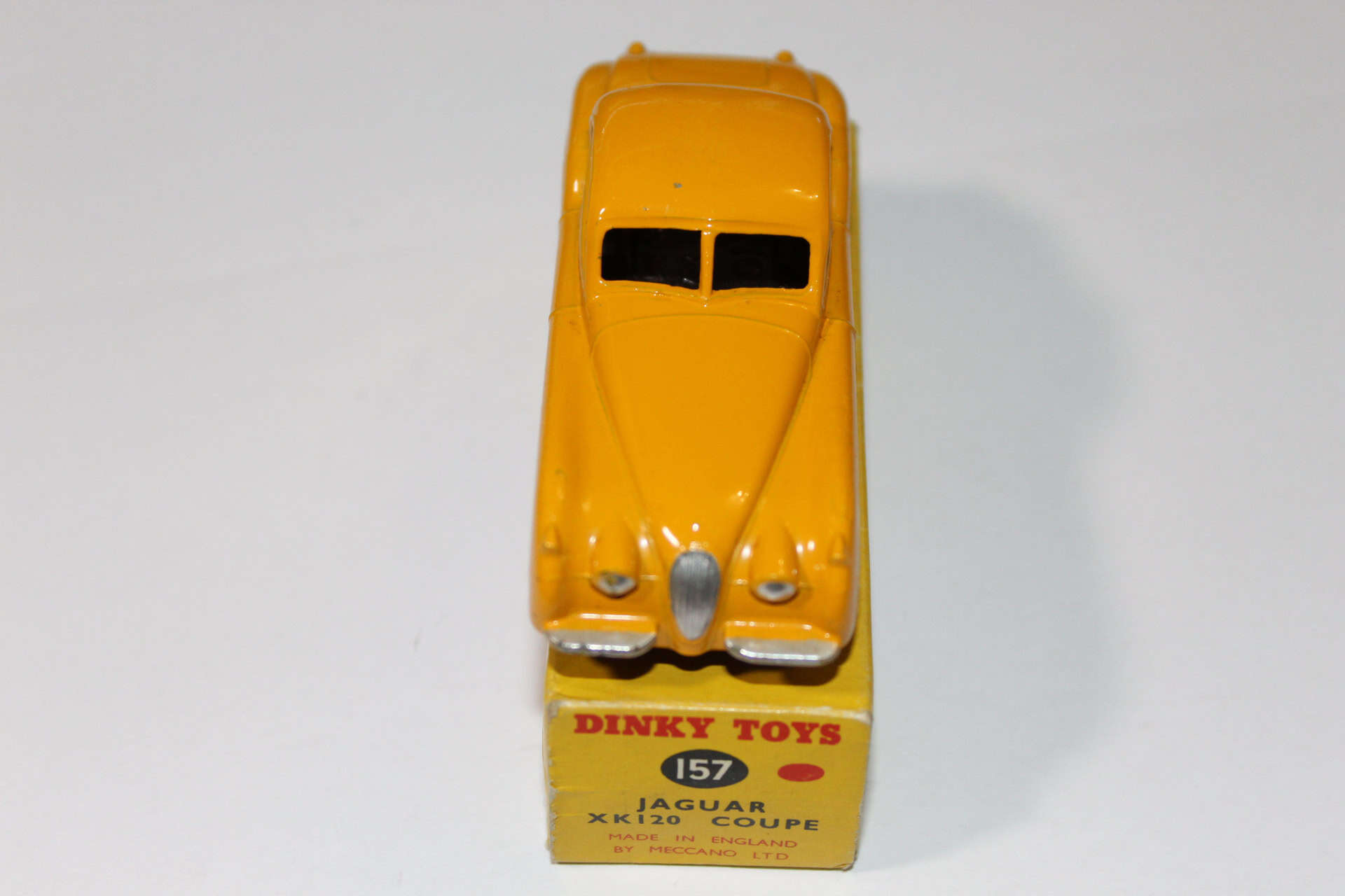 Vintage yellow Dinky Toys Jaguar 157 model car for collectors.