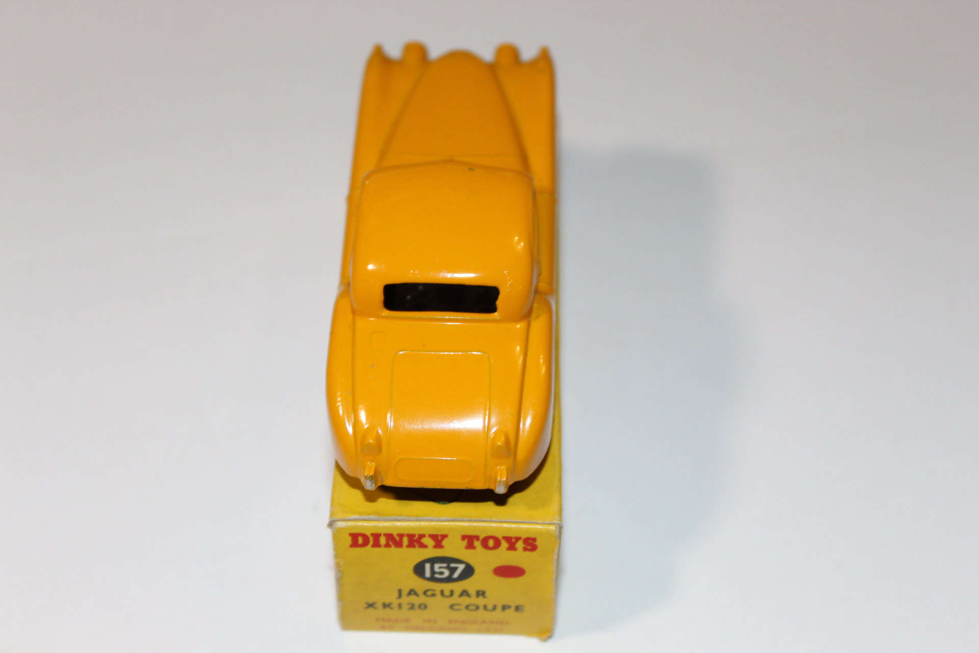 Vintage Dinky Toys 30C Jaguar Daimler model car, yellow diecast collectible.