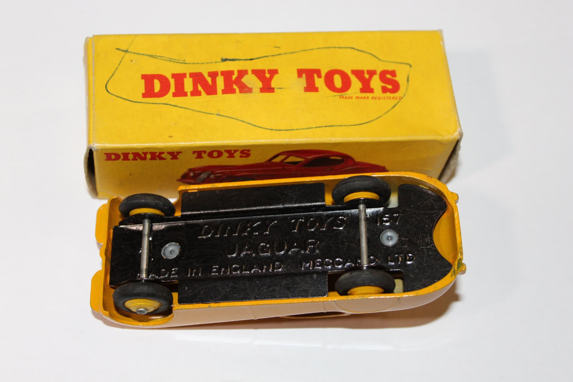 Dinky Toys 30C Daimler diecast model car on yellow box, collectible toy vehicle.