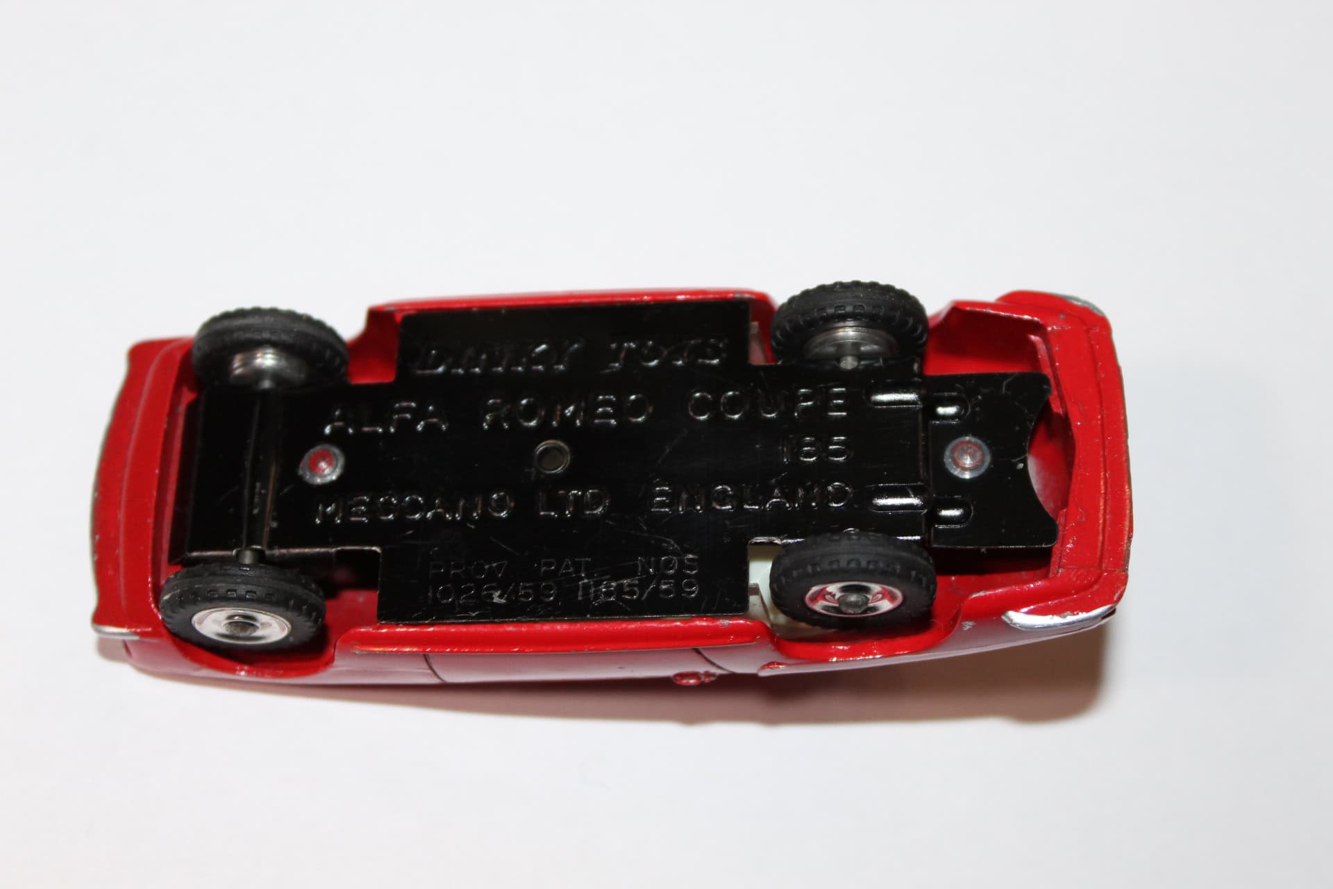 Dinky Toys 185 Alfa Romeo 1900 Super Sprint diecast model car, underside view showing details.