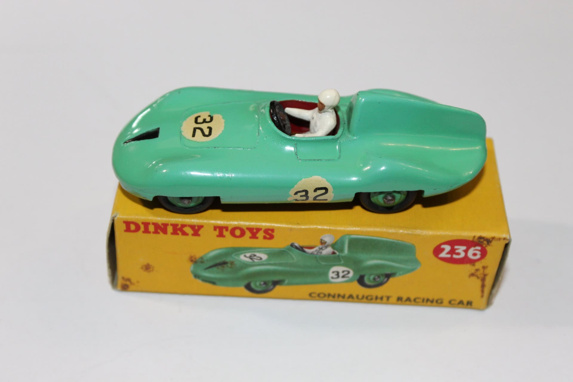 Vintage Dinky Toys Connaught Racing Car model with driver figure.