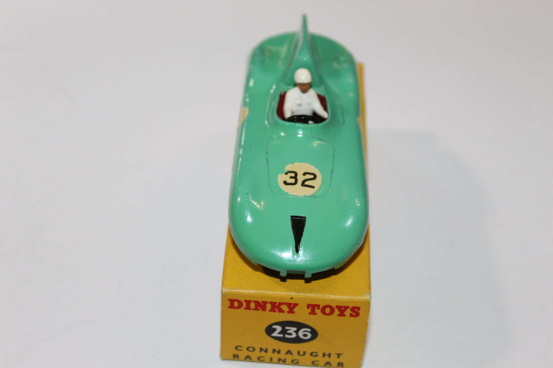 Dinky Toys 236 Connaught Racing Car model with driver figure, vintage diecast racing vehicle.
