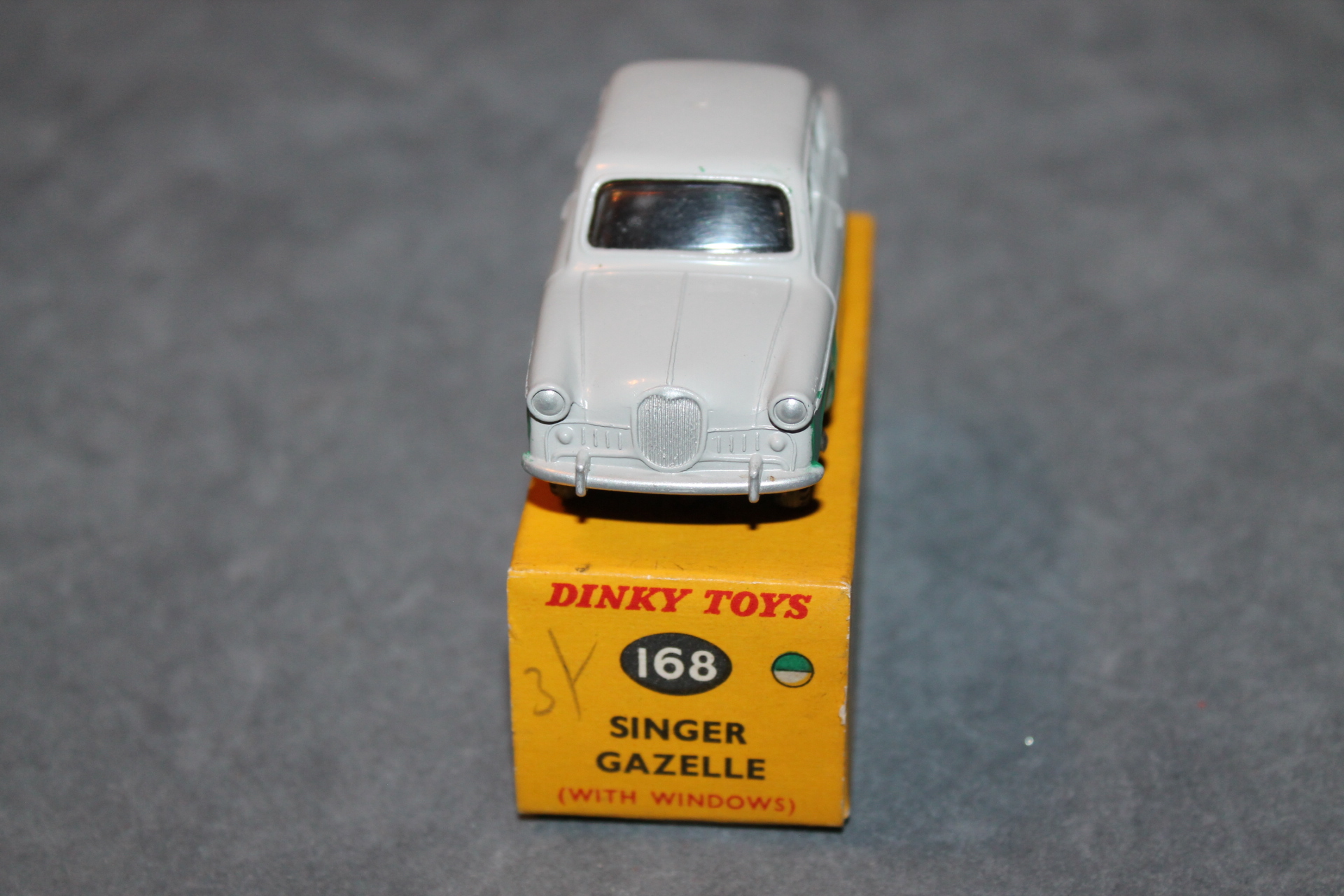 A Dinky Toys No. 168 Singer Gazelle, finished in grey and green with