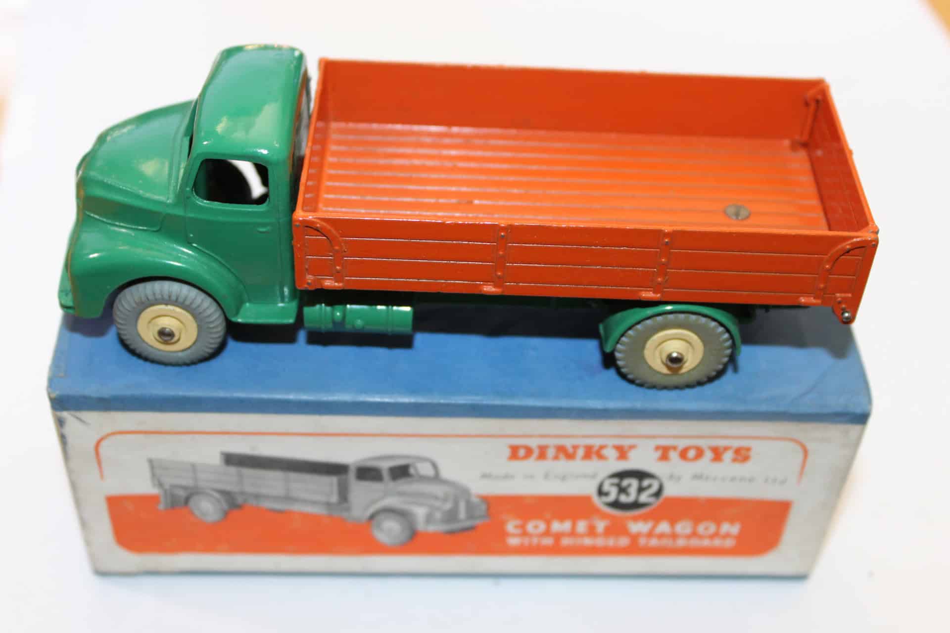 Vintage Dinky Toys 532 Comet Wagon with tailboard, green cab and orange bed, collectible diecast mod.