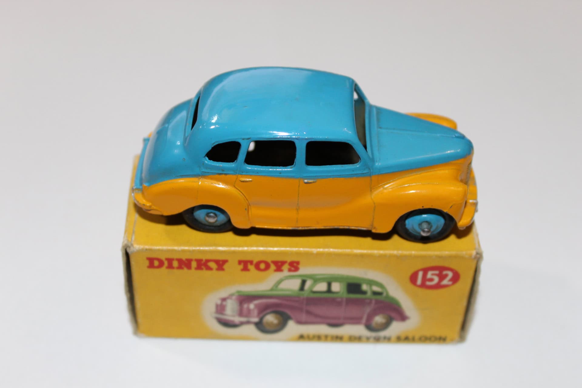Vintage Dinky Toys Austin Devon model car, yellow and blue, with original box.