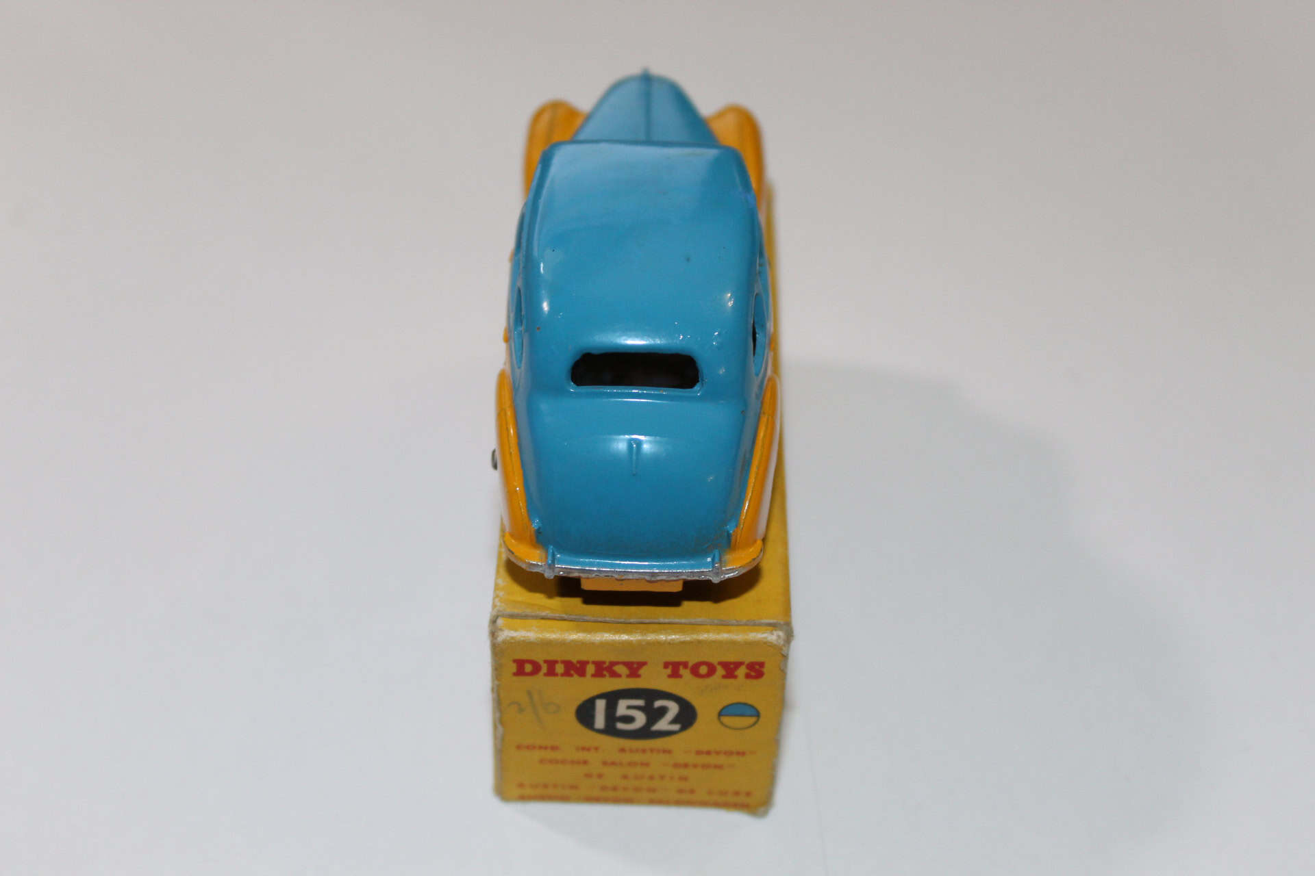 Dinky Toys 152 Austin Devon diecast model car on original box, collectible vintage toy.