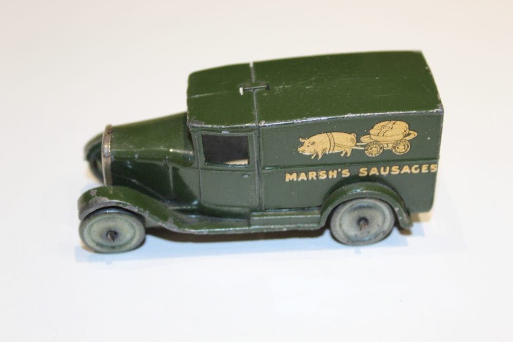 Vintage Dinky Toys Pre-War Marshes Sausages delivery van model, Type 1, in green color.