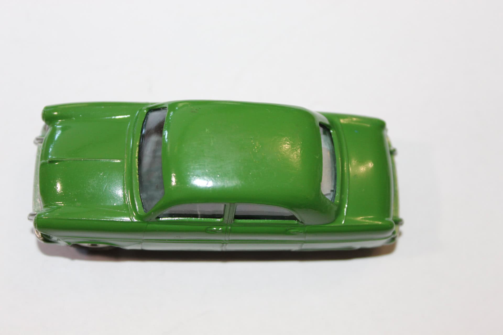 Vintage green diecast model of Ford Consul Saloon car.