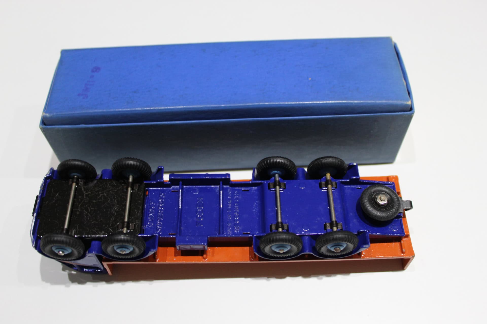 Dinky Toys 503 Foden flat truck model with blue cab and orange flatbed, detailed scale model.