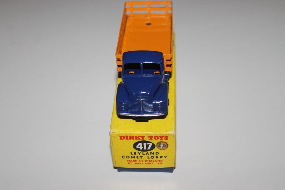 Dinky Toys 417 Leyland Comet Wagon diecast model with orange flatbed and blue cab.