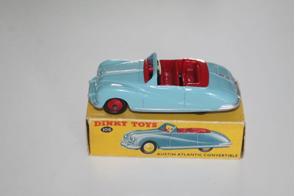 Vintage Dinky Toys 106 Austin Atlantic Convertible diecast model car, blue with red interior.