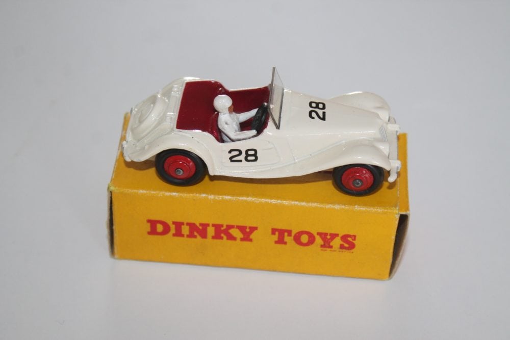 Dinky Toys 108 MG Midget race car with driver figure on yellow box.