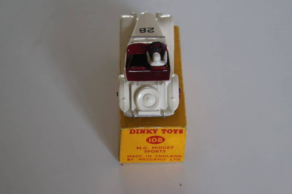 Vintage Dinky Toys 108 MG Midget race car with detailed interior and packaging.