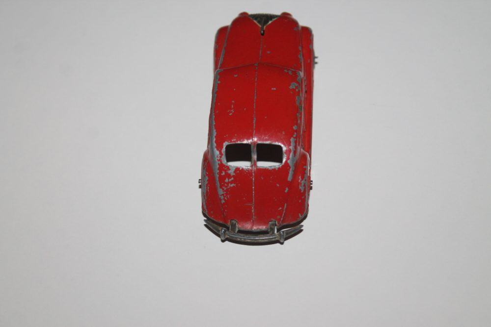 Vintage Dinky Toys Chrysler Airflow model, pre-war diecast car, red finish.