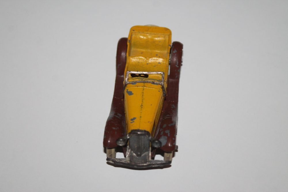Vintage yellow and brown diecast model car, Dinky Toys 024g, classic sports tourer.