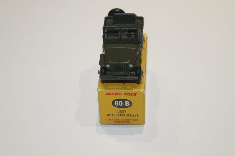 Detailed Dinky Toys Willys Hotchkiss Jeep in green with original box.