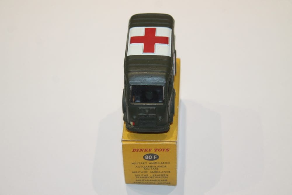 Dinky Toys 080F military ambulance model with red cross symbol, detailed miniature vehicle for colle.