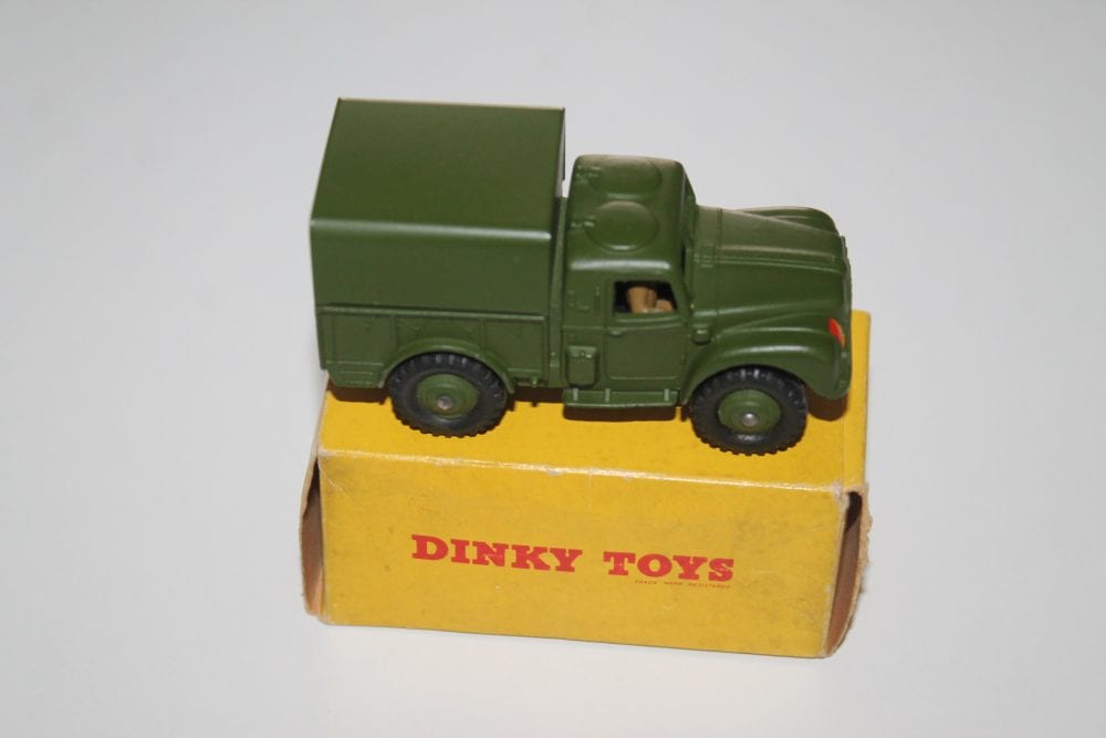 Vintage Dinky Toys 641 Army 1-Ton Cargo Truck in green with yellow base.