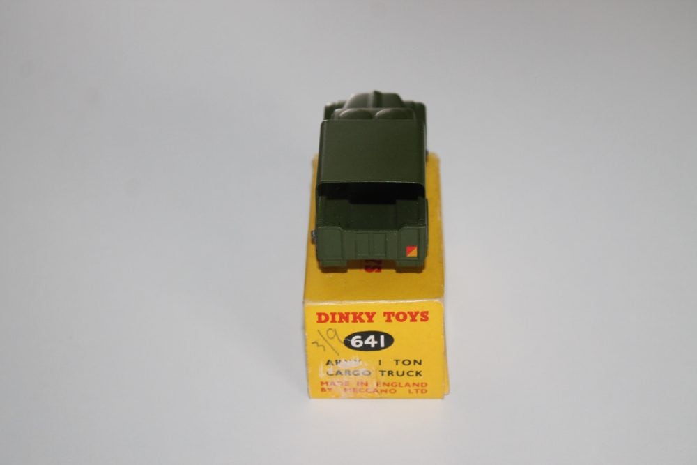 Dinky Toys 641 Army 1-Ton Cargo Truck model in green with yellow packaging, vintage diecast toy.