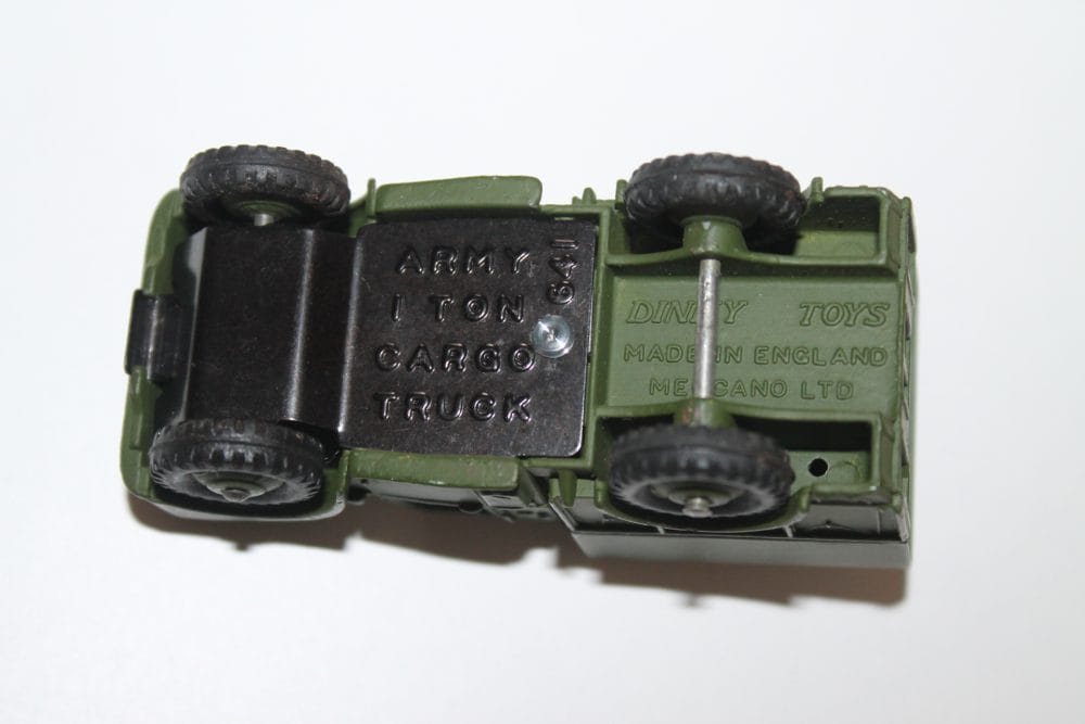 Dinky Toys 641 Army 1-Ton Cargo Truck model in green with black wheels, made in England.