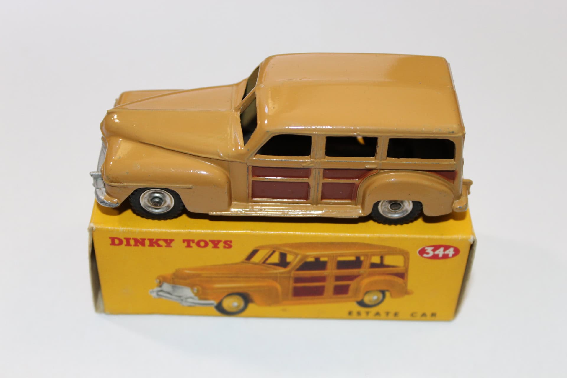 Vintage Dinky Toys 344 estate car with silver spun hubs, yellow model on box.
