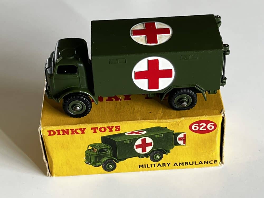 Dinky Toys 626 military ambulance model with red cross symbols, vintage diecast toy.