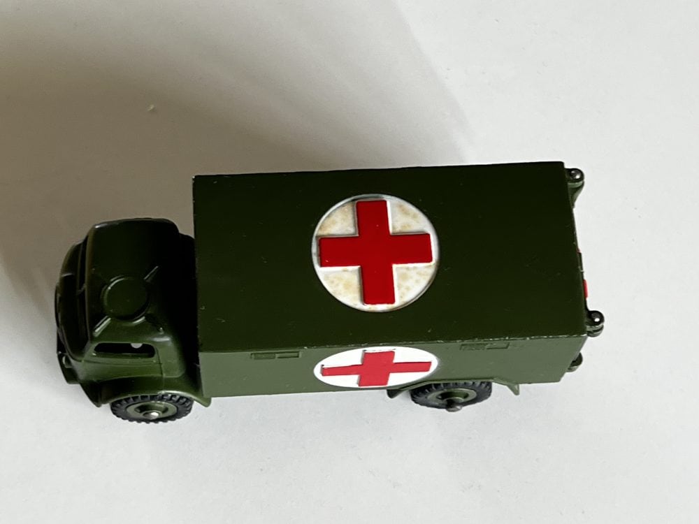 Dinky Toys 626 Army Ambulance model in green with Red Cross symbols for collectible diecast toy enth.