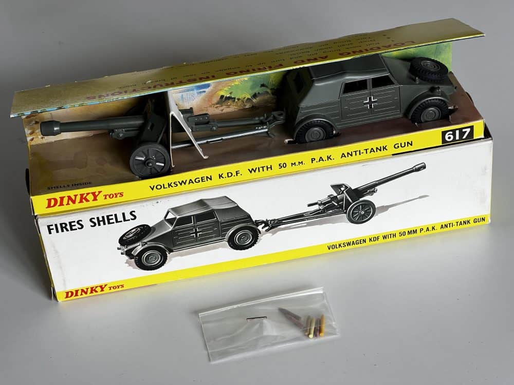 Vintage Dinky Toys Volkswagen KDF with anti-tank gun model for collectors.