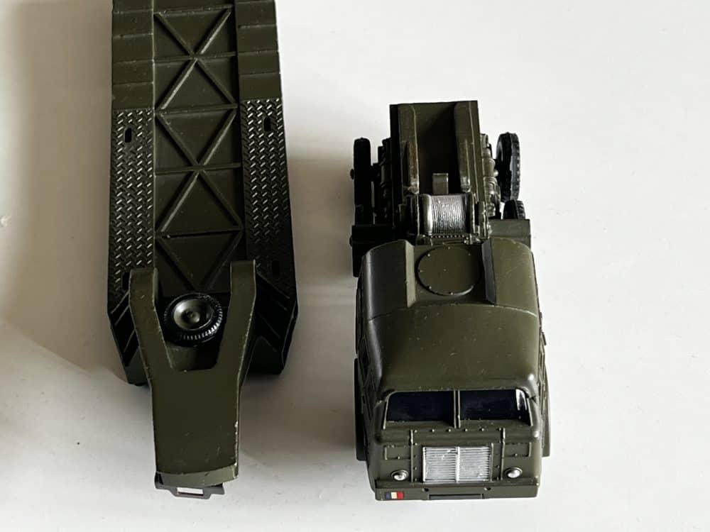 Vintage French Dinky 890 Berliet tank transporter model with detailed window glazing.