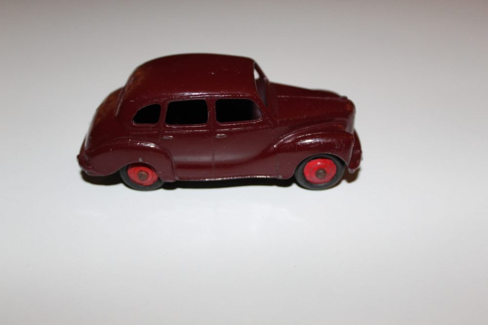 Dinky Toys 040d Austin Devon diecast model car, vintage toy collectible, red miniature vehicle.