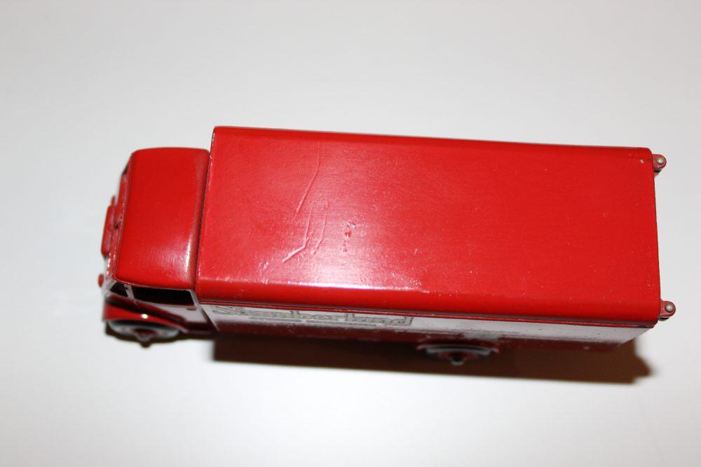 Dinky Toys 514 Guy Slumberland Van diecast model on white background.