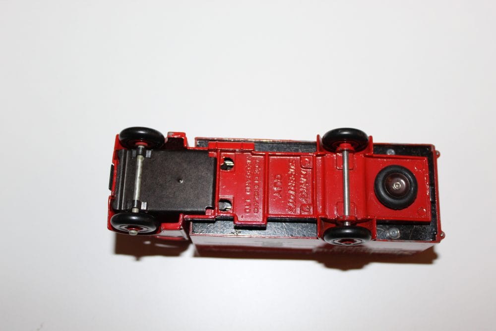 Vintage Dinky Toys 514 Guy Slumberland Van model, underside view.