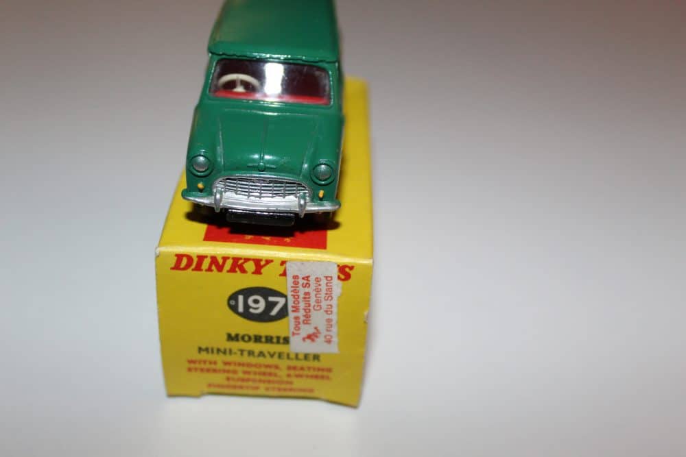 Vintage Dinky Toys 197 Morris Mini Traveller model on yellow box display.