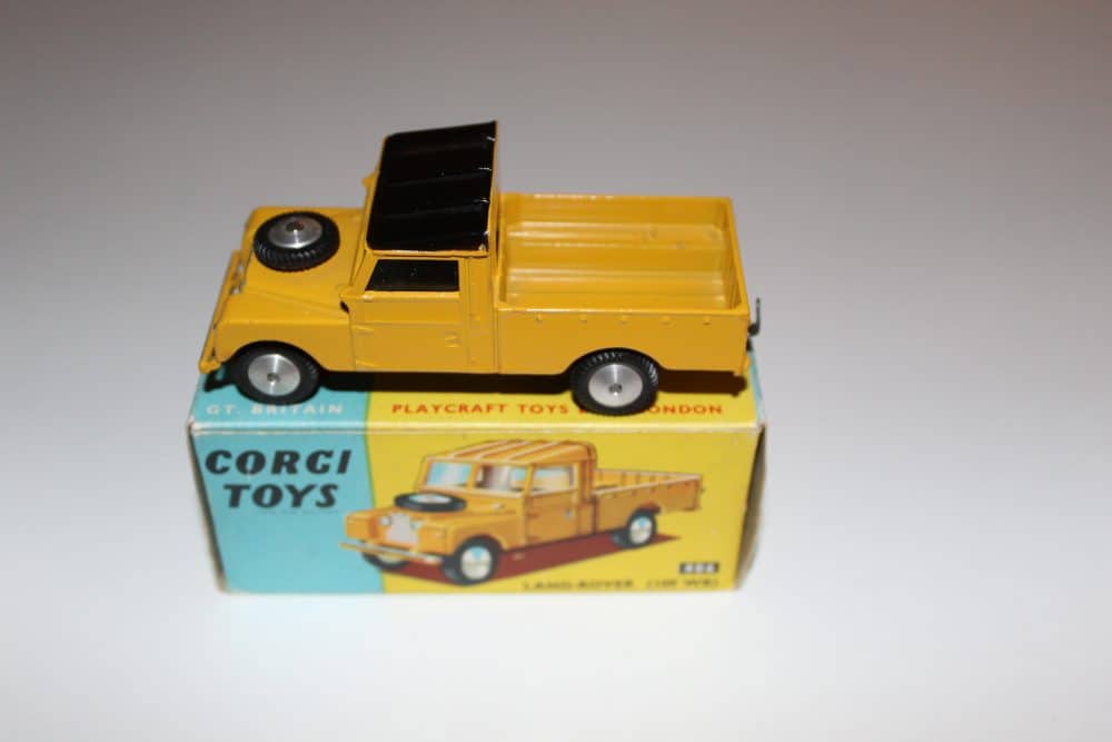 Vintage Corgi Toys 406 Land Rover diecast model on box.