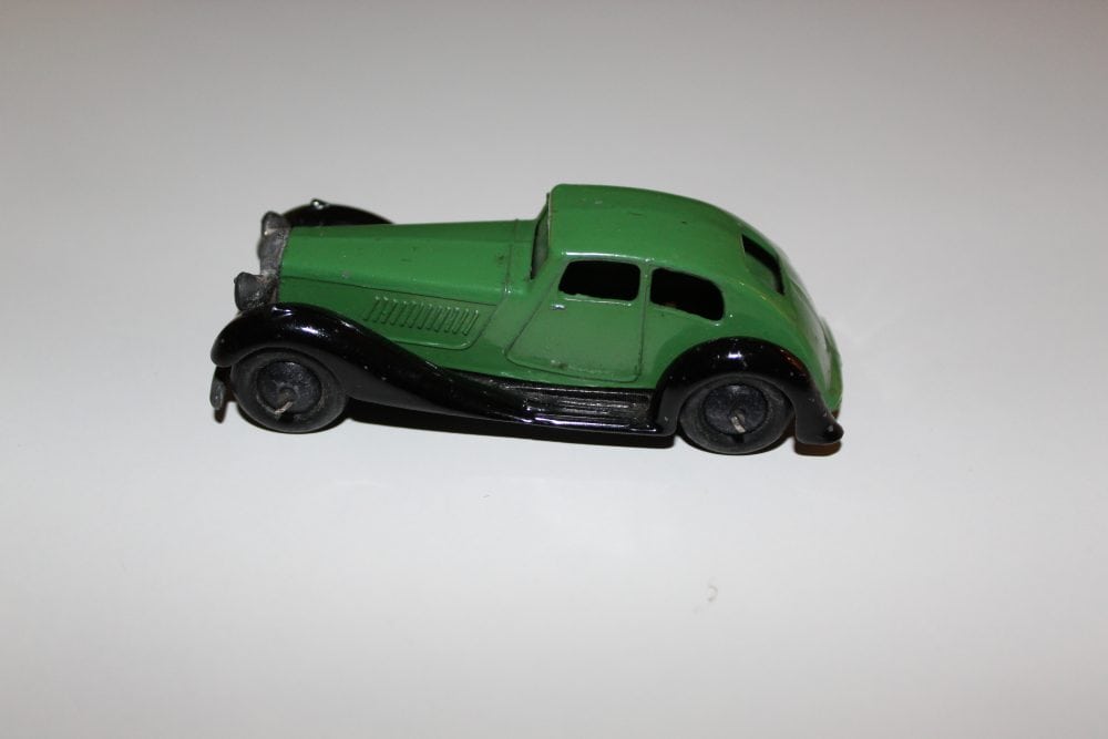 Vintage Dinky Toys 36d Rover diecast model car, green and black, collectible toy.