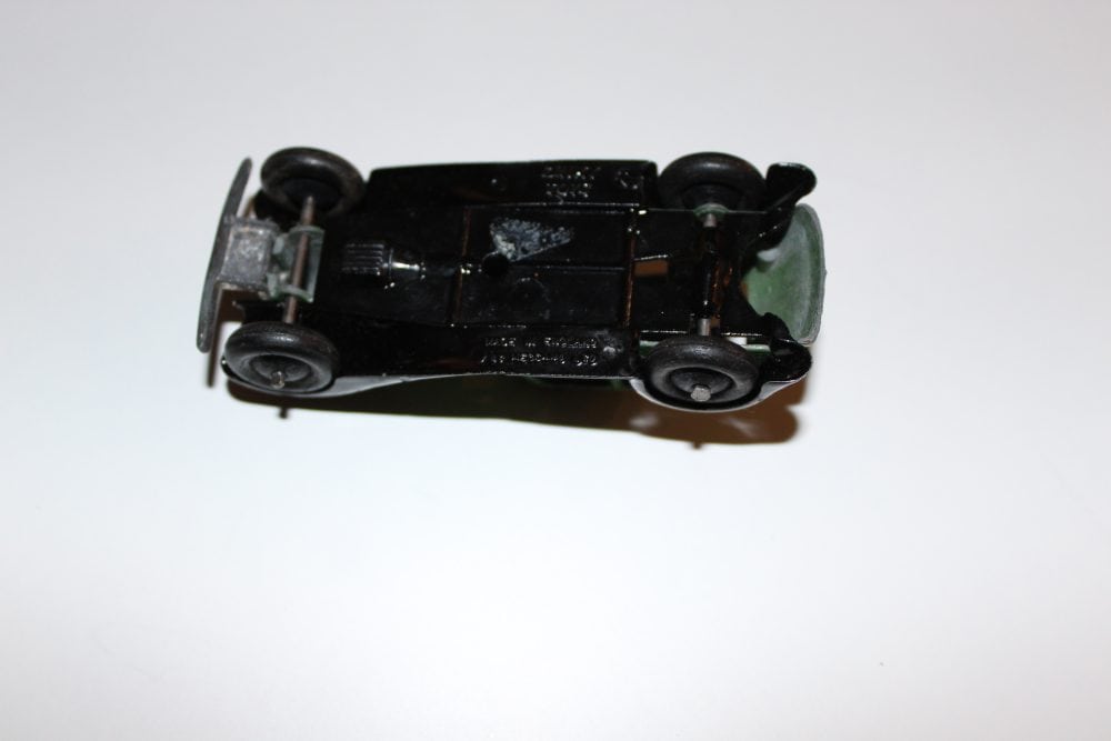 Vintage Dinky Toys 36d Rover diecast model car on white background.