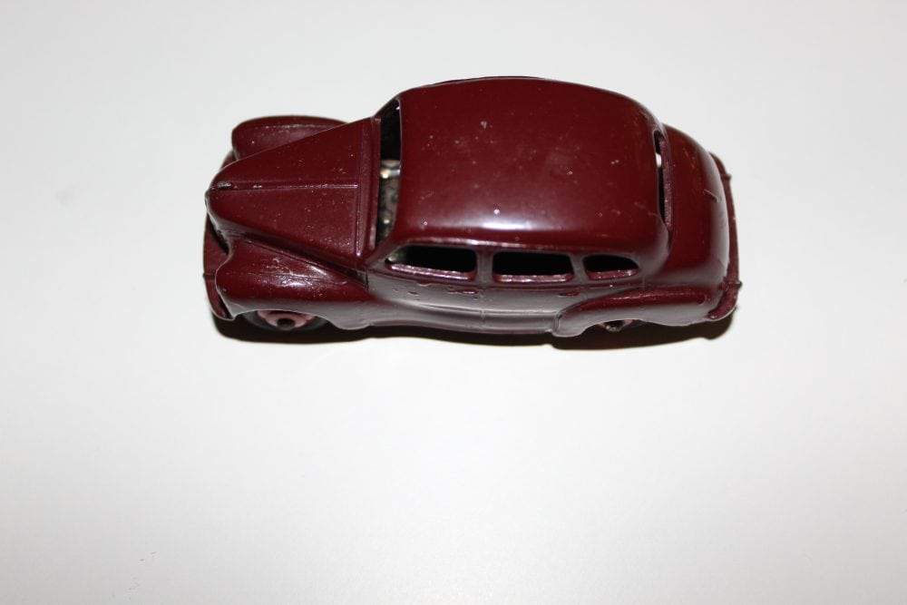 Vintage Dinky Toys Austin Devon model car, diecast collectible, red color, detailed miniature vehicl.